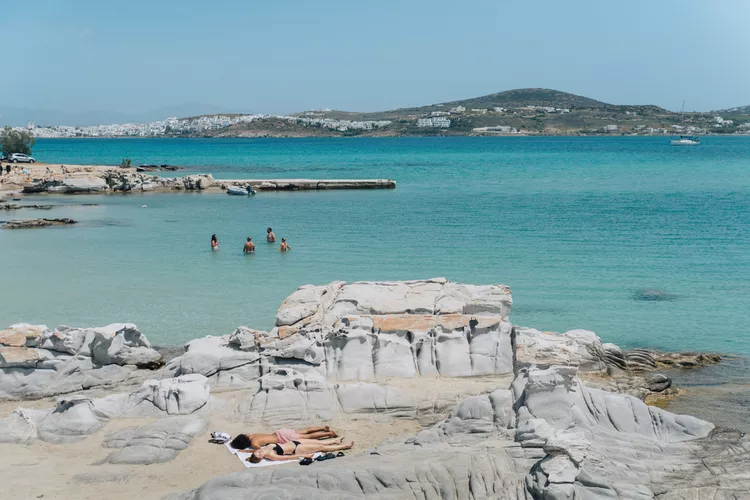 Swimmers and sunbathers on Paros, a Greek island